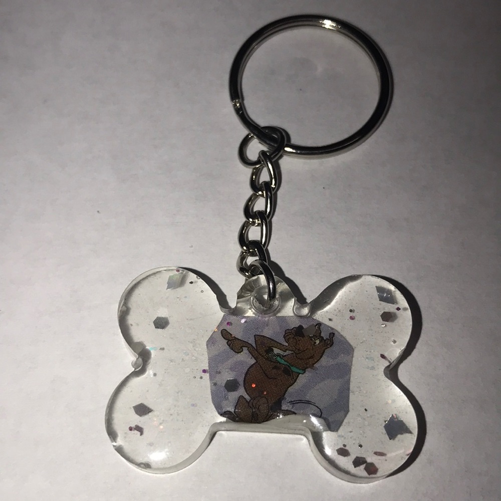 Custom epoxy mini bone 🦴 keychain with Scooby-Doo sticker and glitter ✨